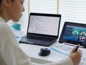 Back rear view of young asian woman, freelance data scientist work remotely at home coding programing on Big data mining, AI data engineering, IT Technician Works on Artificial Intelligence Project.