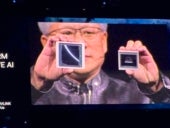 NVIDIA CEO Jensen Huang shows the Blackwell (left) and Hopper (right) GPUs at NVIDIA GTC 2024 in San Jose, California on March 18.